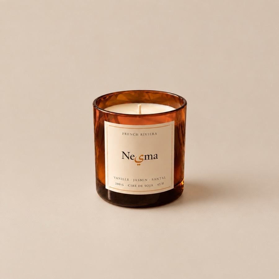 The Nesma Vanille candle on a plain background, label facing forward.